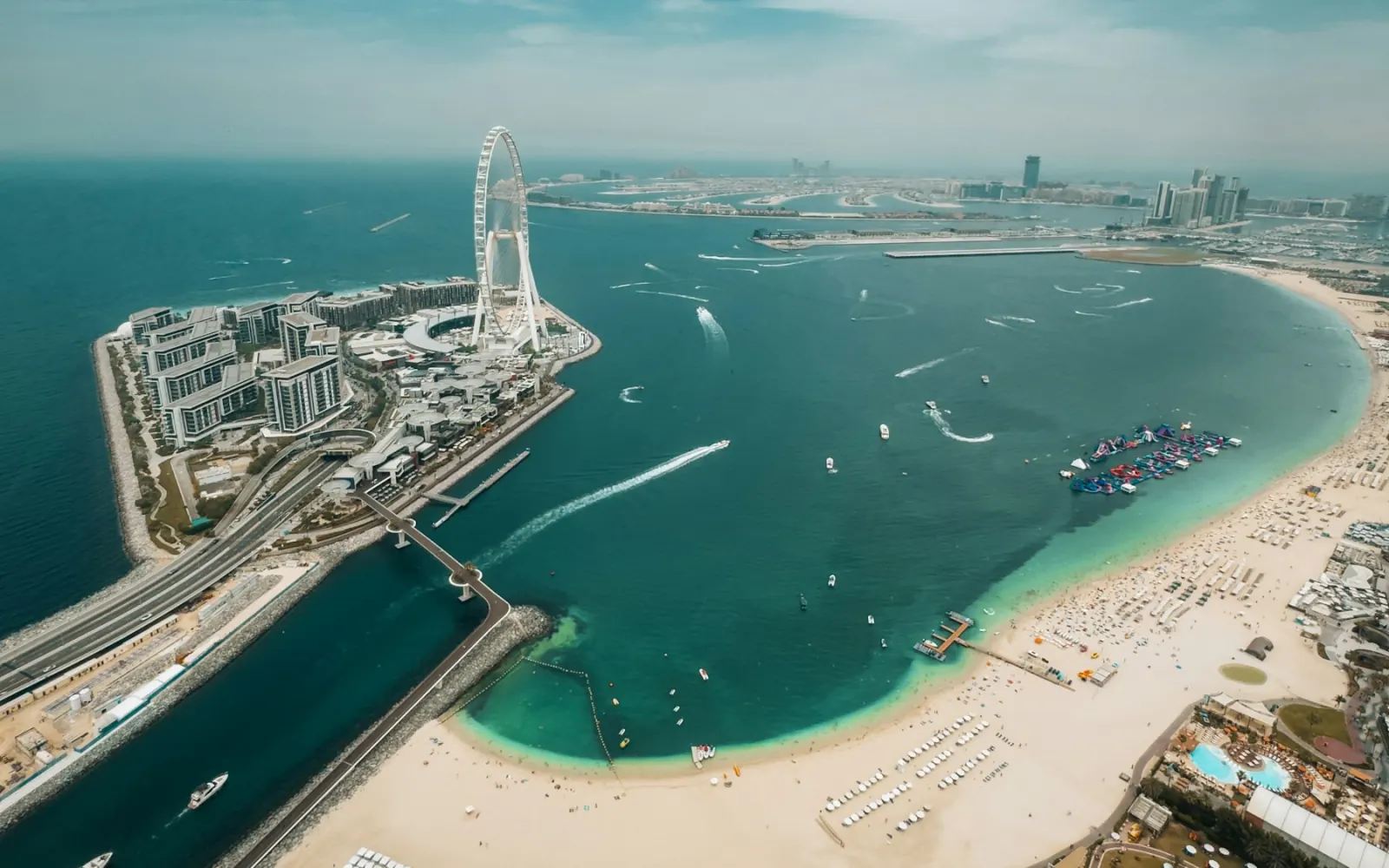 Aerial view of Bluewaters Island, Ain Dubai and the JBR beachfront with the Marina towers behind